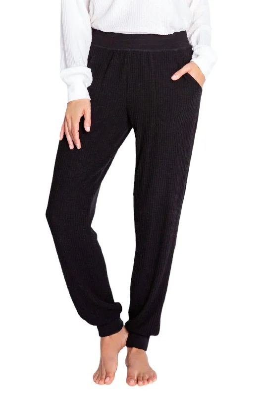 All-black tight trousers for women with simple, chic design for formal occasions -Plush And Thermal Sweatpants In Black